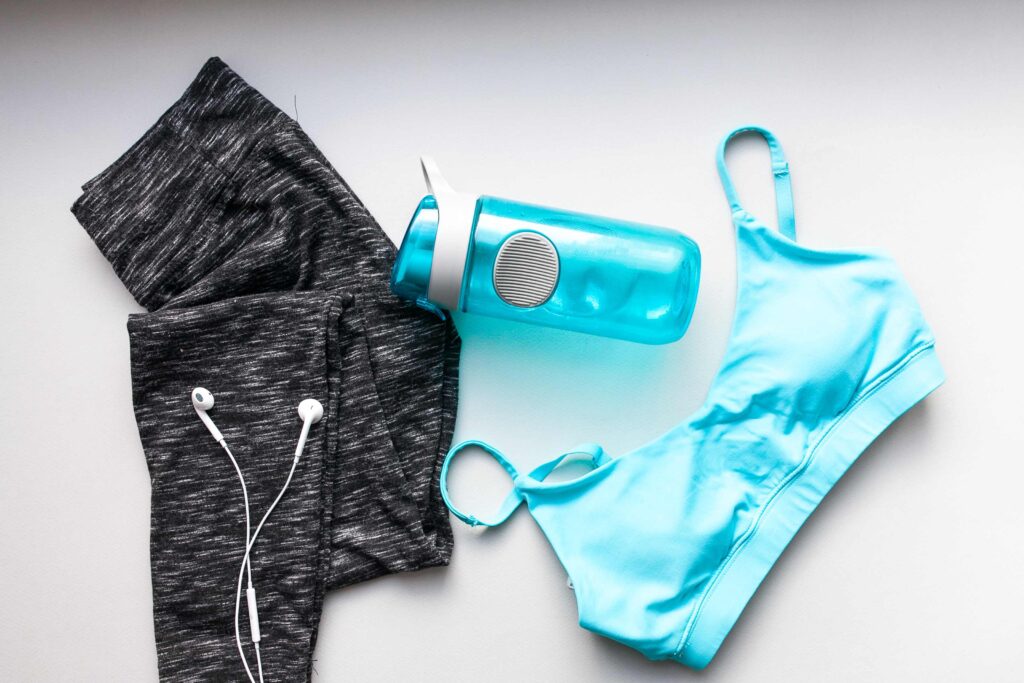 Folded yoga outfits made from sustainable materials representing yoga brands and ethical fashion